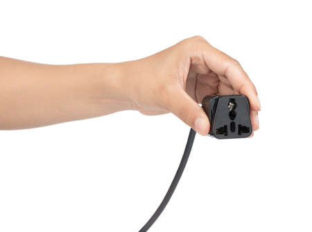Hand holding Power cable UK 3 Pin Plug isolated on a white background