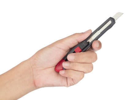 Hand holding Paper Cutter Knife isolated on a white background