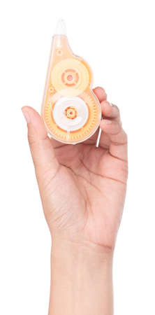 Hand holding Correction tape isolated on white background.