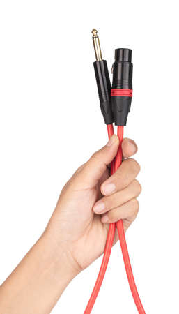 Hand holding Microphone Cable isolated on white background.の写真素材