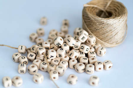 Wooden alphabet beads with hemp cordの写真素材