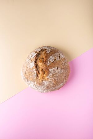 Flat lay with bread on a two-color surface. Colorful template with place for text.の写真素材