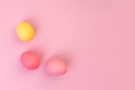 Easter eggs on pink background. Copyspace. Flat lay.の写真素材