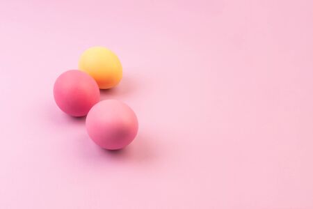 Easter eggs on pink background. Copyspace.の写真素材