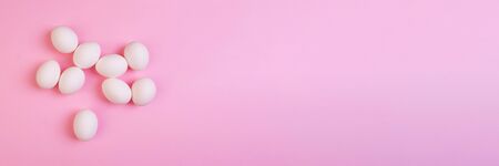 Beautiful banner with easter eggs. Food event concept. Bright festive decor. Colorful pink...