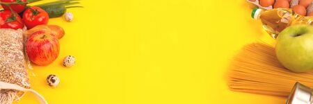 Food packaging on yellow background. Quarantine food delivery home. Flatlay banner with copyspace.