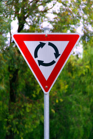 Roundabout Warning Sign - Current Australian Road Sign for left-hand traffic (reflective)の写真素材
