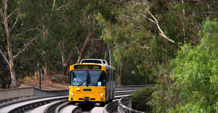 Bus traveling at high speeds on the O-bahn Track, Adelaide, Australiaの写真素材