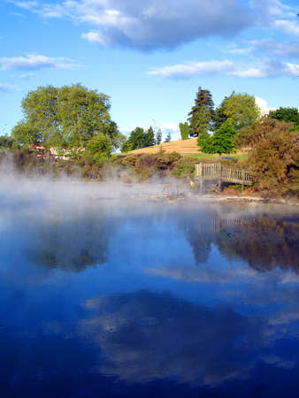 Geothermal Activity of Kuirau Park, with wooden lookout and cloud reflections through the steam. Rotorua, New Zealandの写真素材