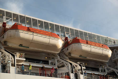 rescue boat Lifeboat white red on deck of a ferryの写真素材