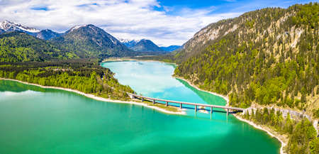 Amazing bridge over accumulation lake Sylvenstein, upper Bavaria. Aerial view. May, Germanyの写真素材