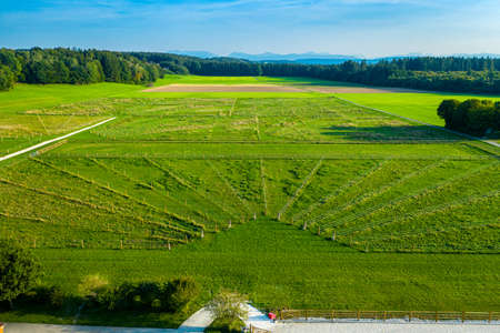 Green pastures of horse farms. Countryside landscape. Drone Aerial Shot. Paddocks, Outdoorの写真素材