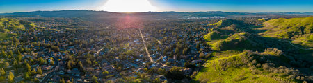 Wallnut Creek Aerial Panorama. Suburban city and green hills at sunsetの写真素材