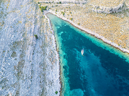 Sail boat and catamaran at a bay on blue turquoise water. Anchor in paradiseの写真素材