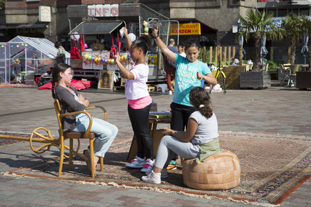 Amsterdam, The Netherlands, 13 September 2014, at West'ival, a free open air Cinema and culture festival on Mercatorplein. slow motion workshop for childrenのeditorial素材