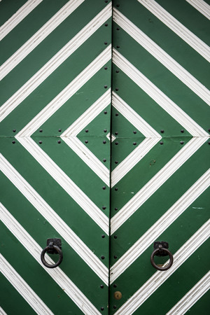 Diamond shape pattern of a green estonian doorの写真素材