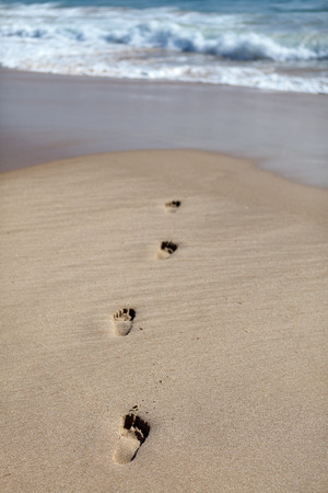 Footprints in the sand, at the beach, Cova do Vapor, Portugalの写真素材