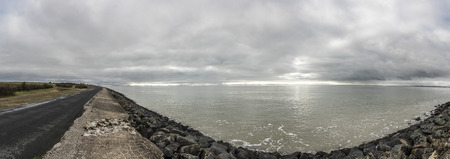 Panoramic view of the dyke proctecting the village of l'Aiguillon sur Mer, Vendee, France