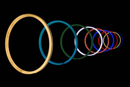 Abstract shiny colorful neon light circlesの写真素材