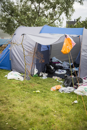 Traena, Norway - July 9 2016: messy tent fixed with a branch at festival campsite at Traenafestival, music festival taking place on the small island of Traenaのeditorial素材