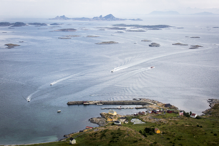 Norwegian landscape ith fjord, mountain and sea taken during the Traenafestival, music festival taking place on the small island of Traenaの写真素材