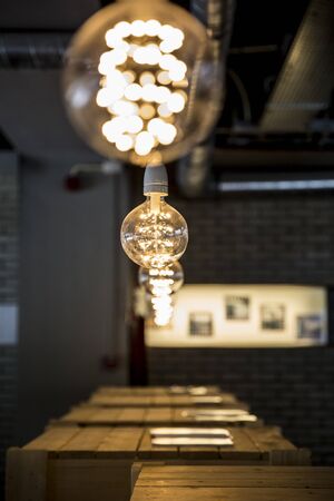 series of modern design light bulbs aligned in a row