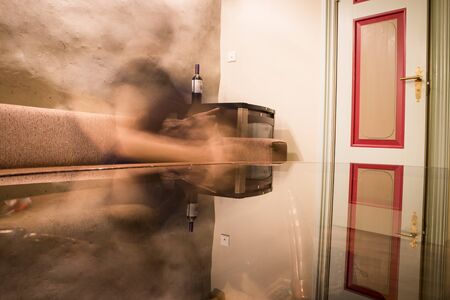 reflection of a man silhouette in a glass table, though conceptの写真素材