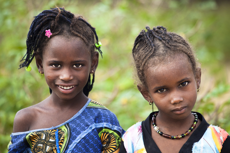 SENEGAL, Ferlo reserve, November, 2 2013: young girls in traditional outfit on the way to school.のeditorial素材