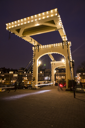 Amsterdam, the Netherlands December 20, 2015: night view of Magere Brug (skinny bridge) during Amsterdam Light Festival 2015のeditorial素材