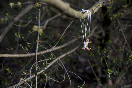 Amsterdam, the Nertherlands. April 12, 2015. Little girl having fun on a swing. Playmobil toy line exist since 1975 and is produced by the German company Brandtaetter.のeditorial素材