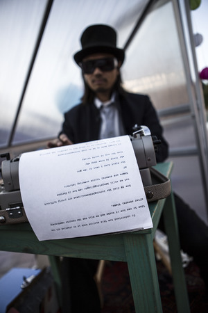 Amsterdam, The Netherlands, 12-14 Septembre 2014, during West'ival, an open air free Cinema and culture festival on Mercatorplein - artistic installation, man typewritingのeditorial素材