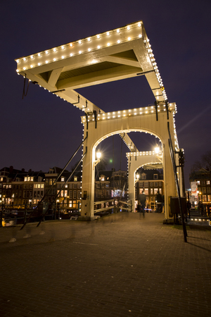 Amsterdam, the Netherlands December 20, 2015: night view of Magere Brug (skinny bridge) during Amsterdam Light Festival 2015のeditorial素材