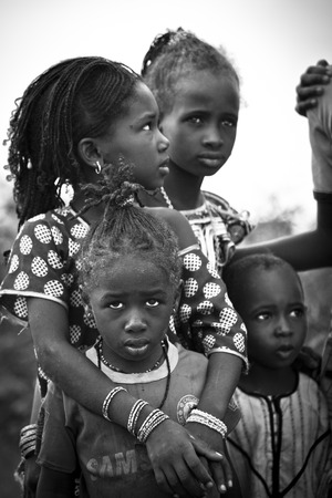 SENEGAL, Ferlo reserve, November, 2 2013: young girls in traditional outfit on the way to school.のeditorial素材