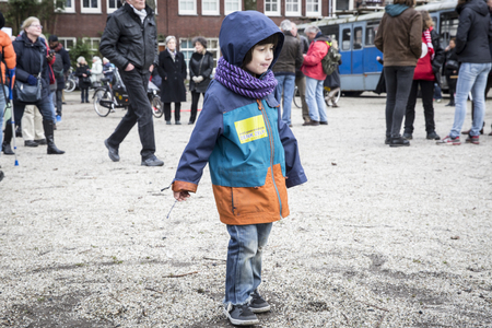 Amsterdam, The Netherlands - February 6,2016: public multi-cultural demonstration organized to protest against racism and islamophobia named "Refugees welcome, racism not!" Woman holding a sign saying later, you will be the black sheepのeditorial素材