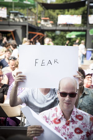 Amsterdam, the Netherlands - July 23, 2016: people writing messages about homosexuality,  Pink Saturday celebrations in Vondelpark for 2016 Gay Euro Prideのeditorial素材