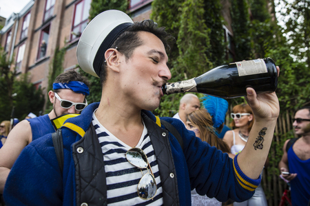 Amsterdam, Netherlands - August 1, 2015: participants in the annual event for the protection of human rights and civil equality - Gay Pride Parade on the Prinsengracht, Amsterdamのeditorial素材