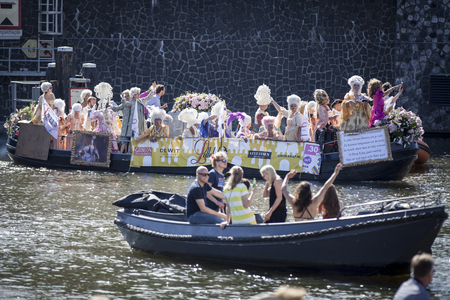 Amsterdam, the Netherlands - August 06, 2016: participants in the annual event for the protection of human rights and civil equality - Gay Pride Parade on the canals during Euro Pride 2016のeditorial素材