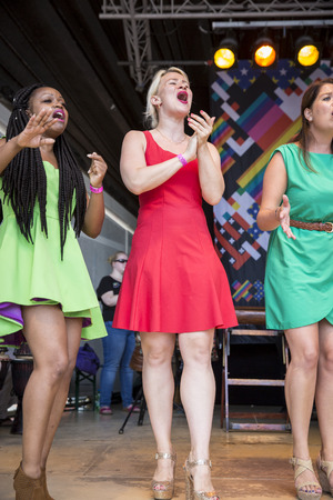 Amsterdam, the Netherlands - July 23, 2016: ZO gospel choir performing at the open air theater in Vondelpark for the Euro Pride Pink Saturday celebrationsのeditorial素材