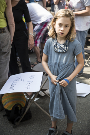 Amsterdam, the Netherlands - July 23, 2016: shy and amazed little girl in Vondelpark during Pink Saturday celebrations for the 2016 Gay Euro Prideのeditorial素材