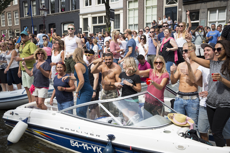 Amsterdam, Netherlands - August 1, 2015: participants in the annual event for the protection of human rights and civil equality - Gay Pride Parade on the Prinsengracht, Amsterdamのeditorial素材