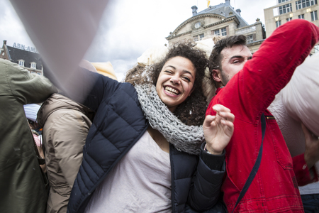 Amsterdam, The Netherlands, Noord Holland - Saturday, April 4 2015 - Pillow Fight on Dam Square as part of the international pillow fight day held in several cities in the worldのeditorial素材