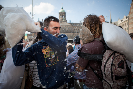 Amsterdam, The Netherlands, Noord Holland - Saturday, April 5 2014 - Pillow Fight on Dam Squareのeditorial素材