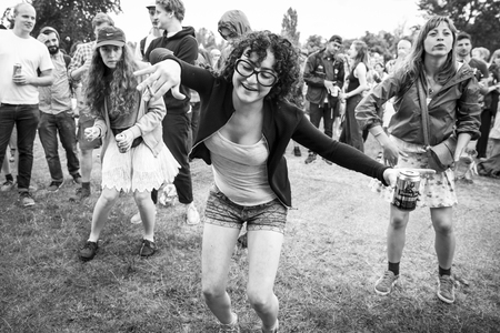 Amsterdam, The Netherlands - July, 5 2015: audience dancing during the concert of Tunisian band Bargou 08 at Amsterdam Roots Open Air, cultural festival held in Park Frankendael on 05/07/2015のeditorial素材