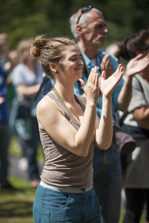 Amsterdam, The Netherlands - July, 3 2016: girl dancing at concert of alternative Electro-Hip Hop Moroccan band N3rdistan at Amsterdam Roots Open Air, free public cultural festival held in Oosterparkのeditorial素材