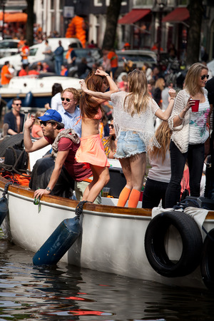 Amsterdam, The Netherlands, April 30, 2014: celebration of the public national holiday King's day - Koningsdag - held every year on 30th of April in the entire country to celebrate King Willem's birthdayのeditorial素材