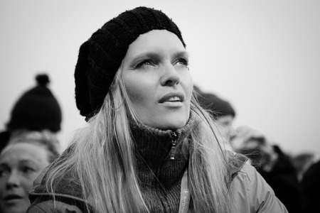 Traena, Norway - July 12: audience with young blond woman during the concert of the Norwegian folk and rock âViolet Roadâ at the Traenafestival, music festival taking place on the small island of Traena in Norway.のeditorial素材