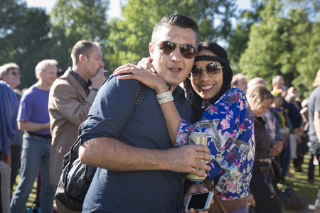 Amsterdam, The Netherlands - July, 3 2016: man and woman in the audience at concert of world music African band Baba Commandant and Mandingo Band at Amsterdam Roots Open Air, free public cultural festival held in Oosterparkのeditorial素材