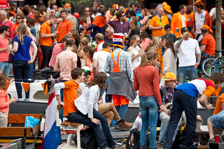Amsterdam, The Netherlands, April 30, 2014: celebration of the public national holiday King's day - Koningsdag - held every year on 30th of April in the entire country to celebrate King Willem's birthdayのeditorial素材