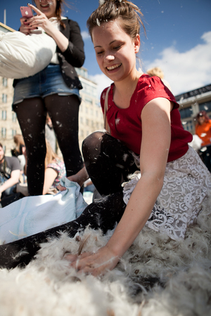 Amsterdam, The Netherlands, Noord Holland - Saturday, April 5 2014 - Pillow Fight on Dam Squareのeditorial素材