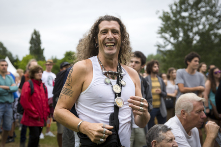 Amsterdam, The Netherlands - July, 5 2015: man with long grey hair and indie tattoo during Amsterdam Roots Open Air, a cultural festival held in Park Frankendael on 05/07/2015のeditorial素材